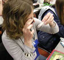 NSTA participant using a Private Eye jeweler's loupe.