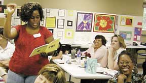 Teacher using a loupe at a Private Eye Workshop