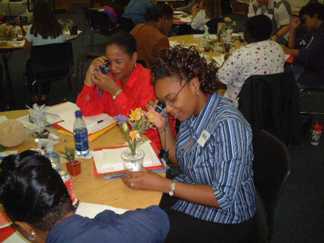 Teachers using Private Eye loupes at a Private Eye Workshop